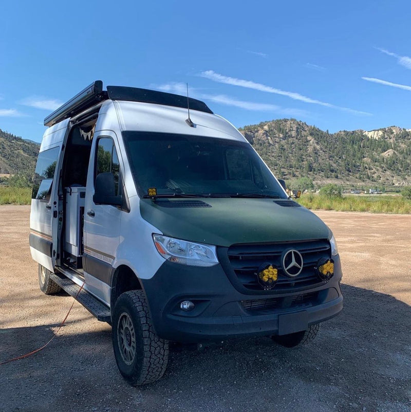 Mercedes Sprinter Storyteller with a 56" x 12" fairing, reverse smile shape and Flatline Van Company roof rack